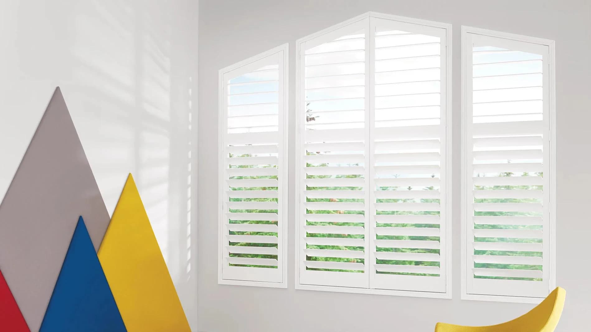 White shutters surrounding a bright living-room window