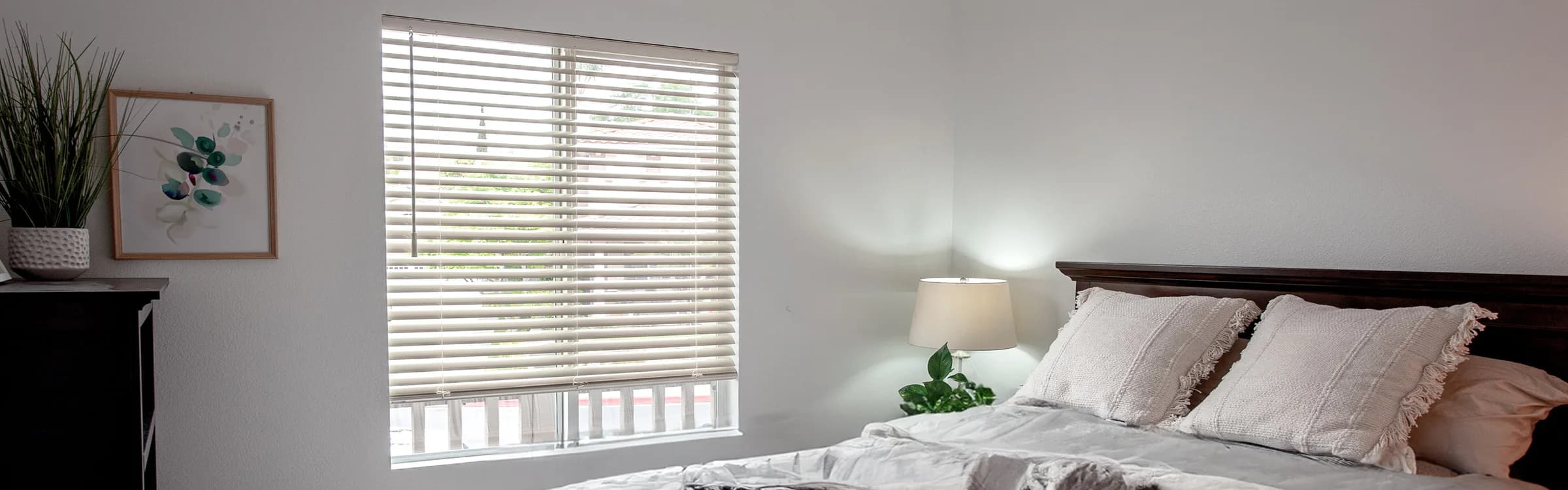 Horizontal blinds fitted to a shallow bedroom window