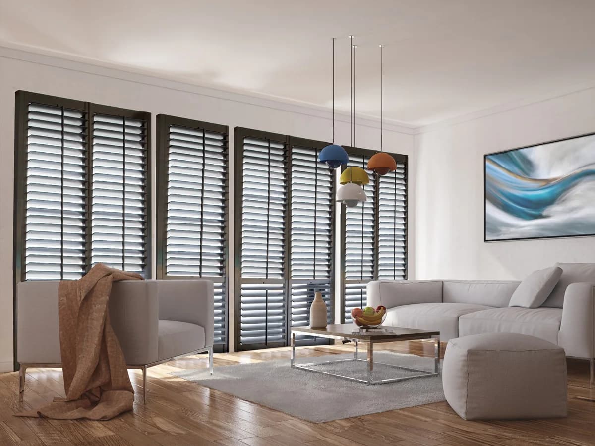 Dark bi-fold shutters spanning a wide living-room opening