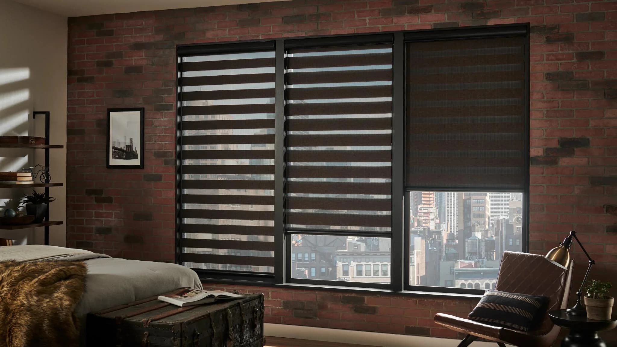 Dark banded shades filtering light in a loft bedroom