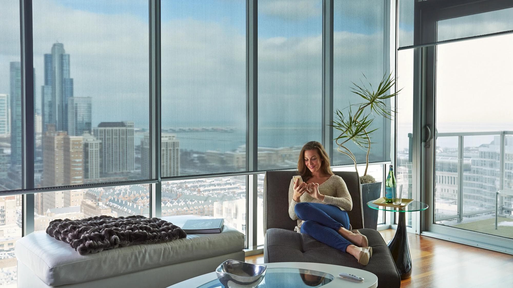 Solar shades controlling glare across high-rise windows