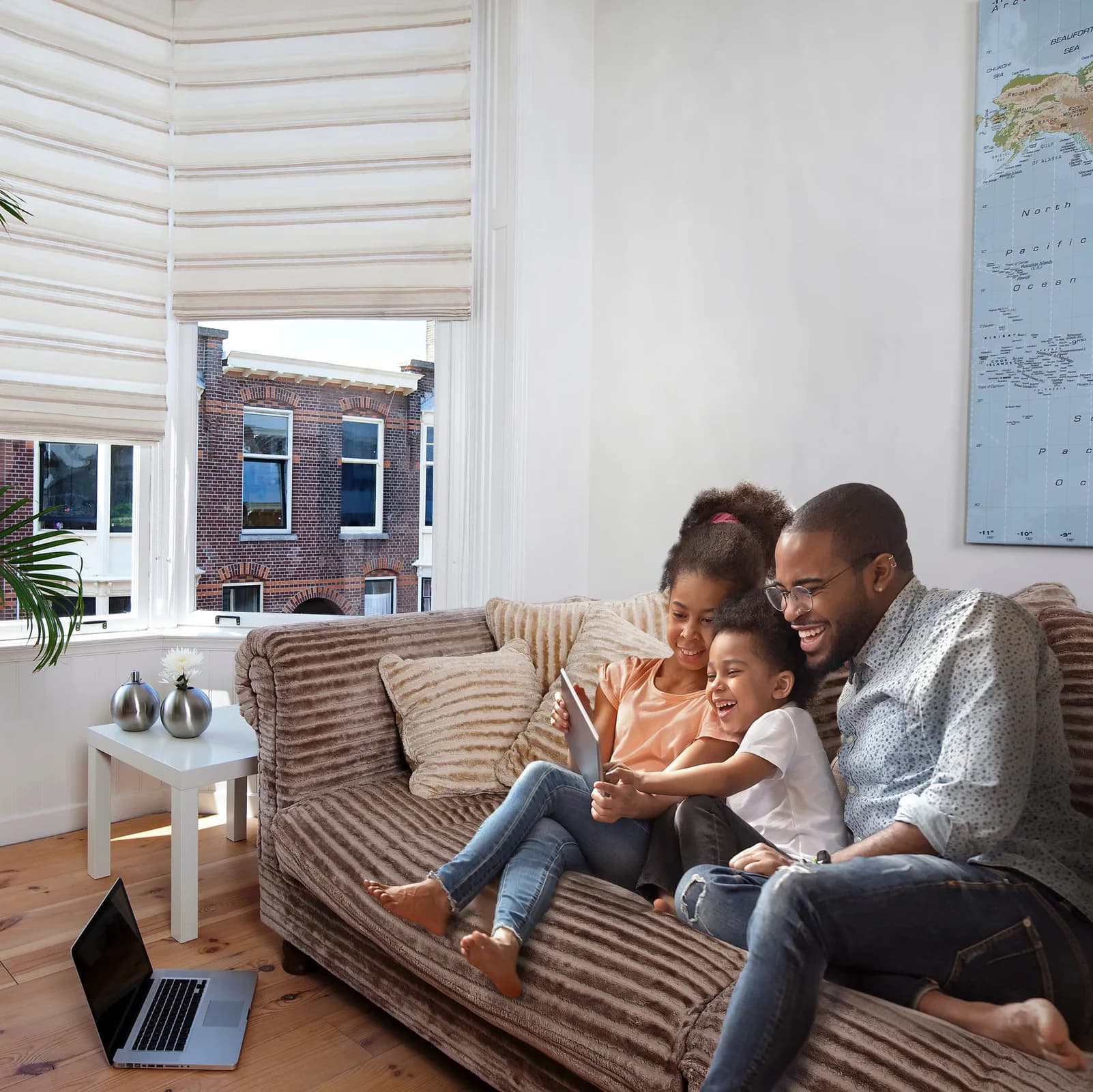 Roman shades framing a relaxed family living room