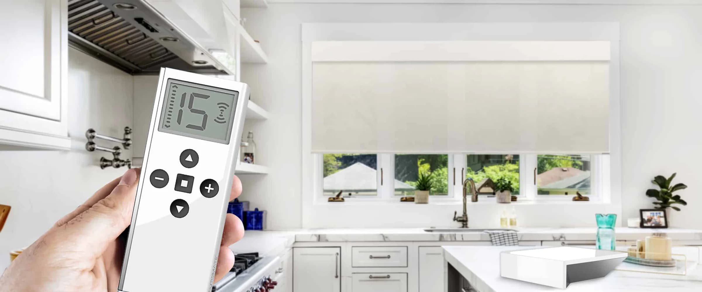 A motorized roller shade operated by remote in a bright kitchen
