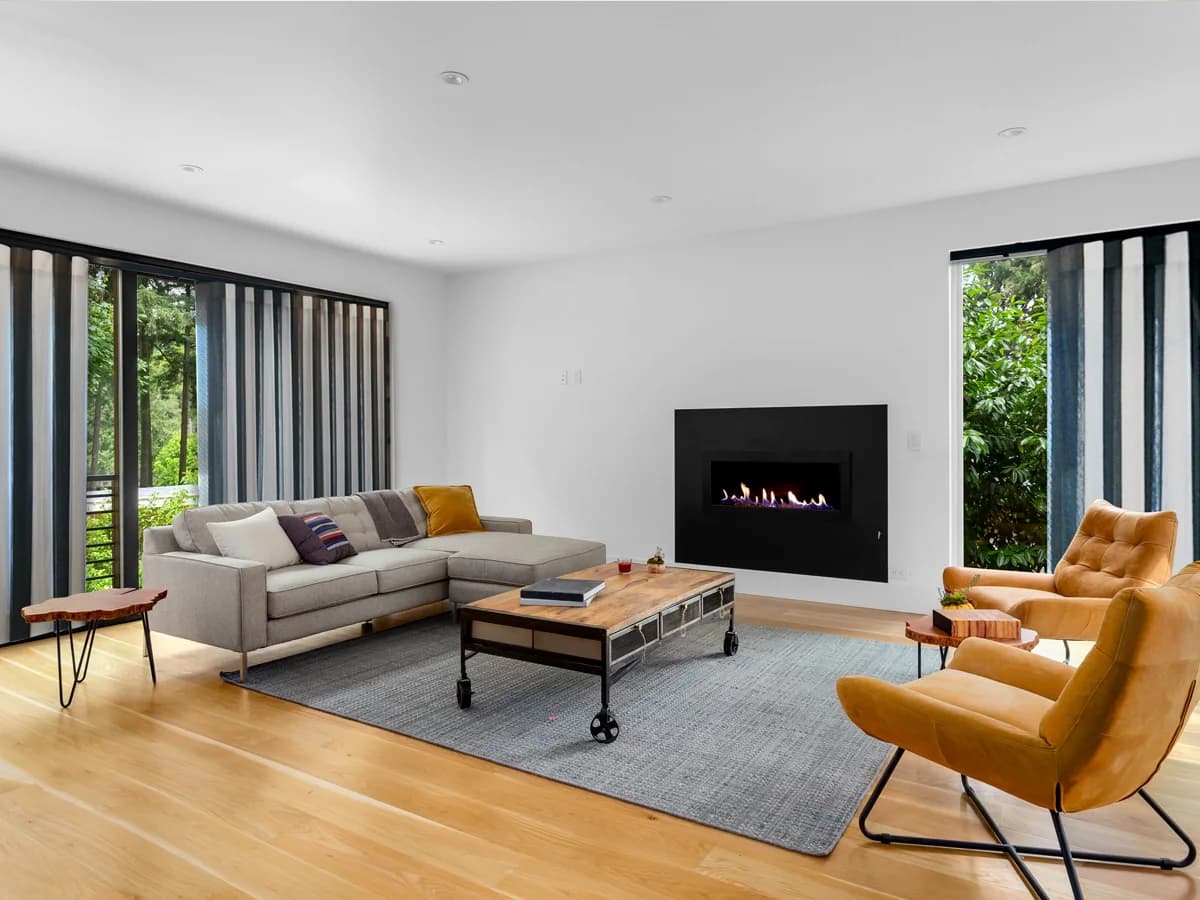 Dark SmartDrape vanes framing a contemporary living room